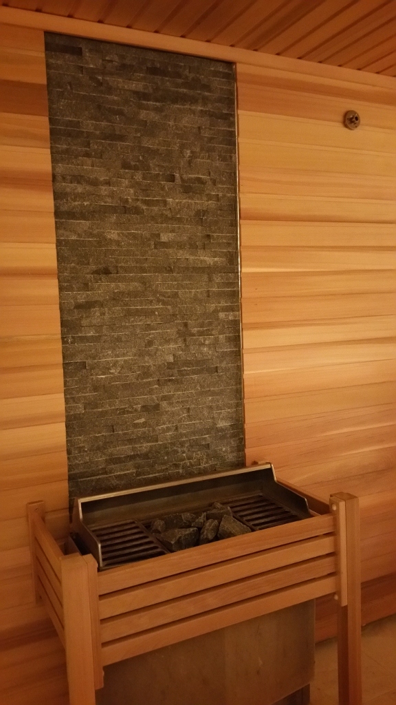 A coal grill inside a sauna room