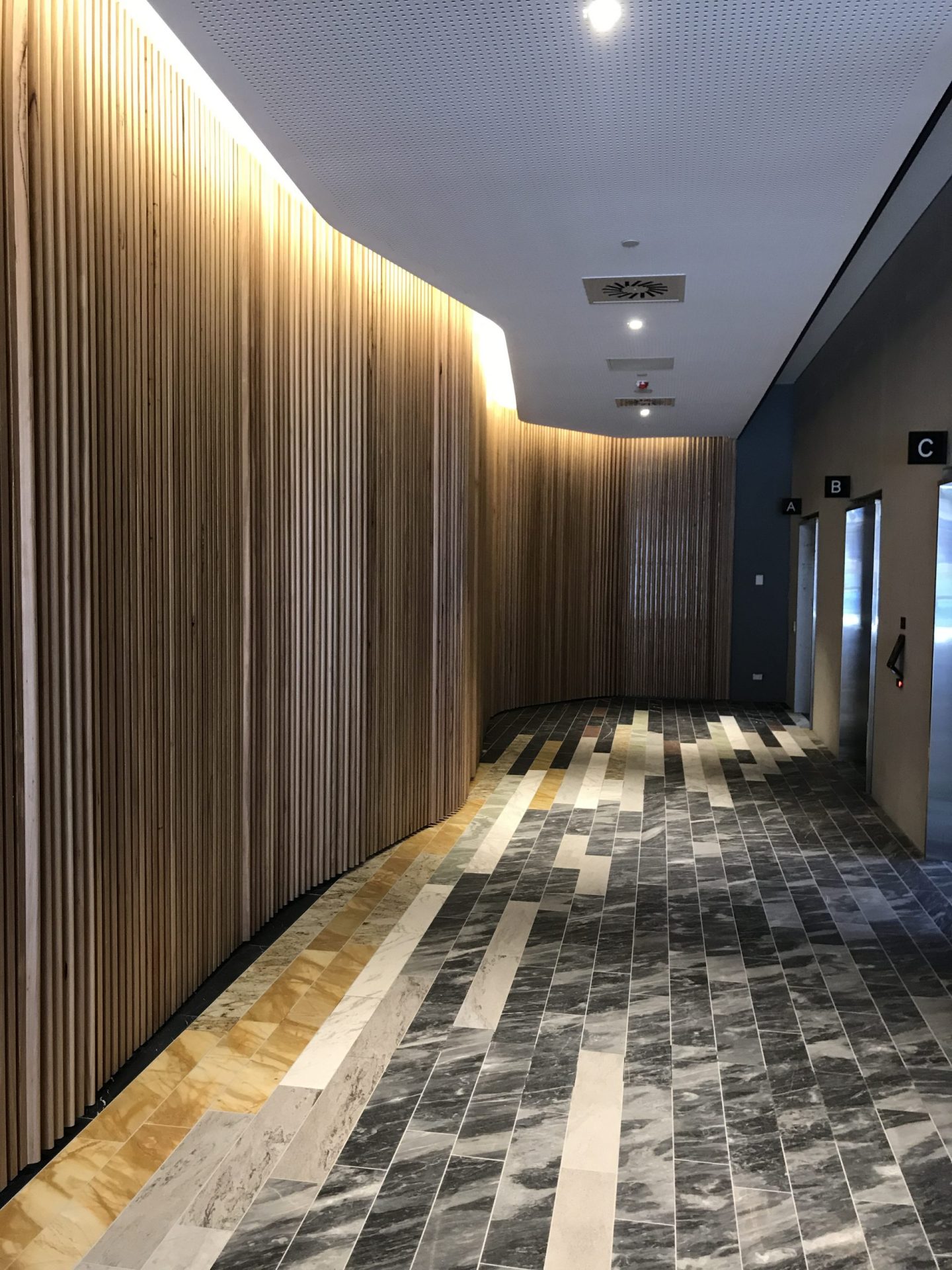 A tiled hallway inside a building