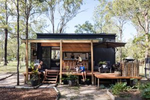 A family enjoying their time outside their tiny home