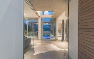 A glass entrace to a luxury house