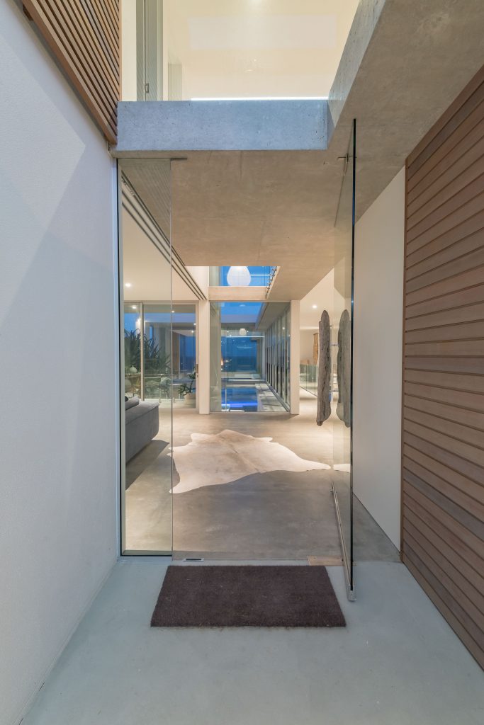 A glass entrace to a luxury house